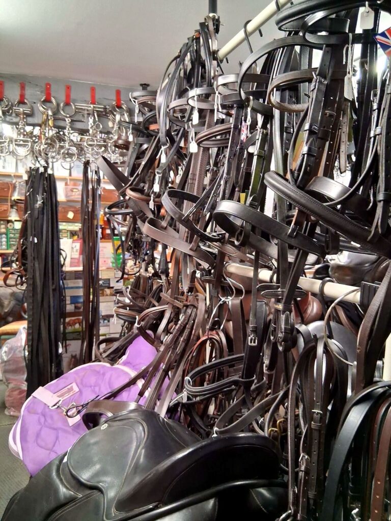 Aisle of bridlework and tack at The Newark Saddler saddlery