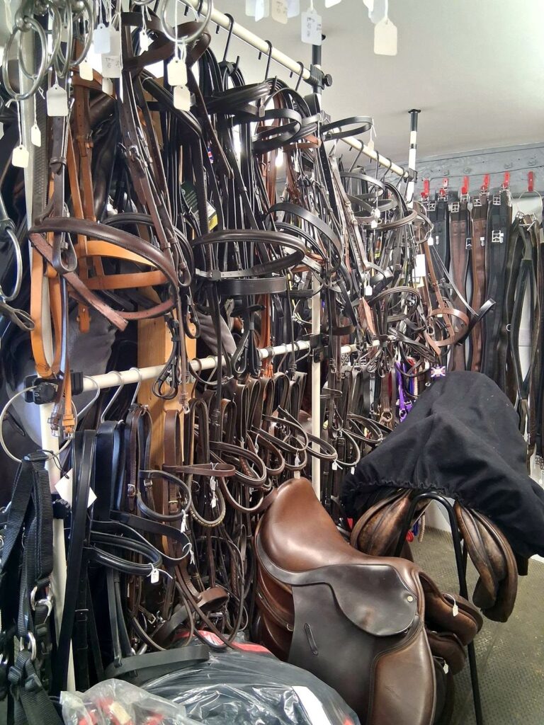 Leather bridles and reins on the rack at The Newark Saddler