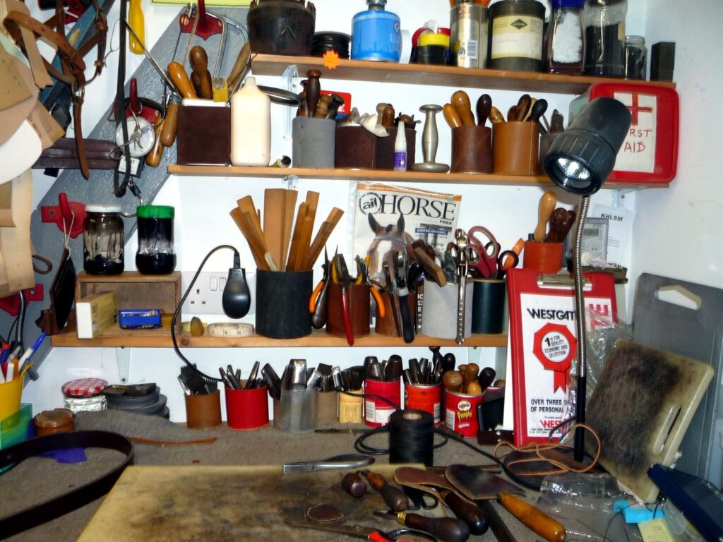 Close-up of a saddler’s hand tools and leather dyes at The Newark Saddler