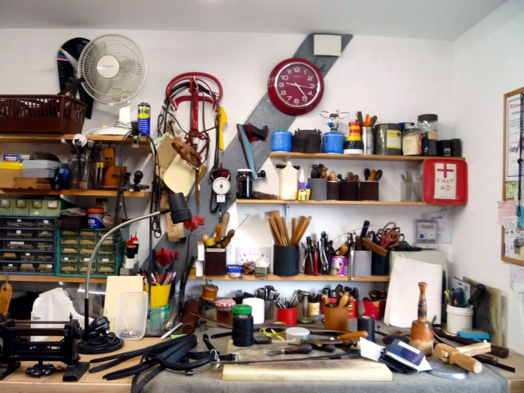 Leatherworking hand tools and a workbench in the Newark saddlery workshop